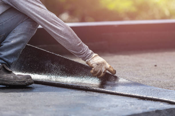 Professional Basement Waterproofing technician working in Longport, NJ